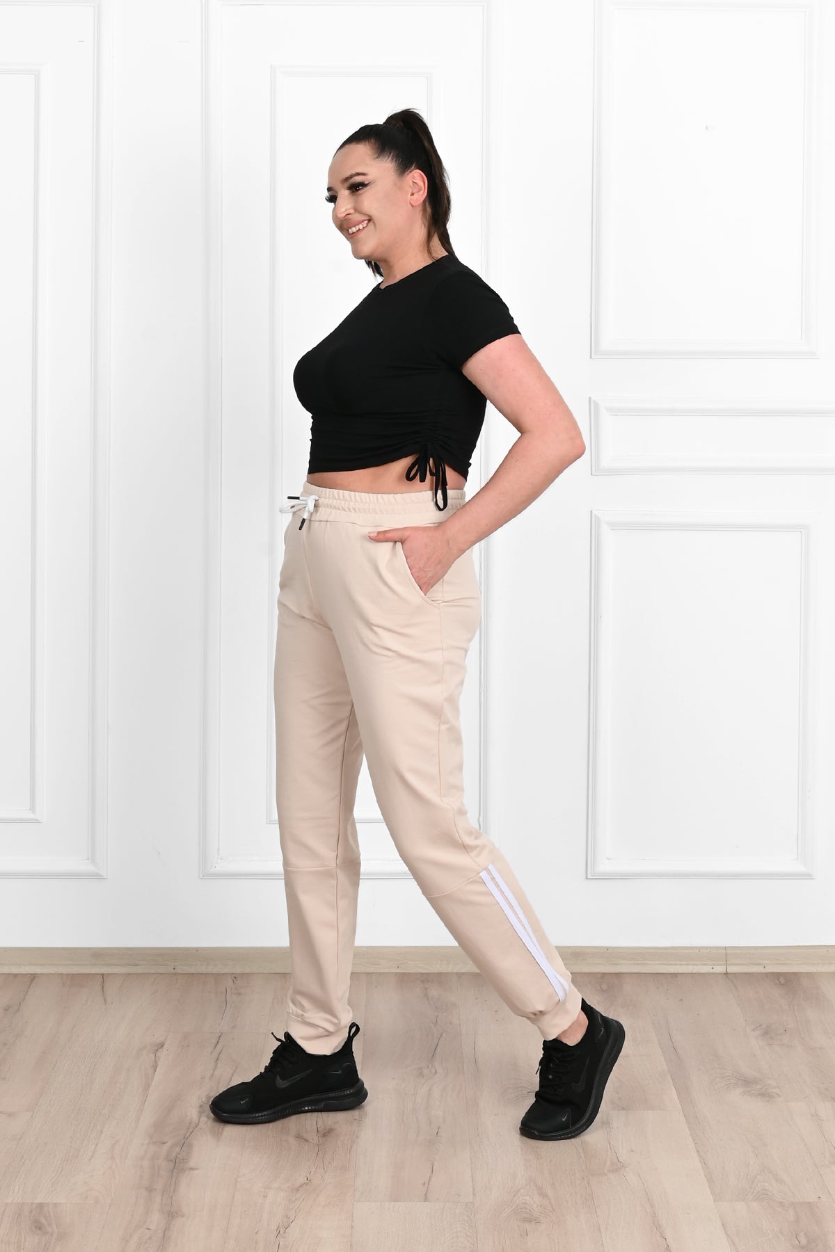 Damskie spodnie dresowe w paski, duże rozmiary 9046